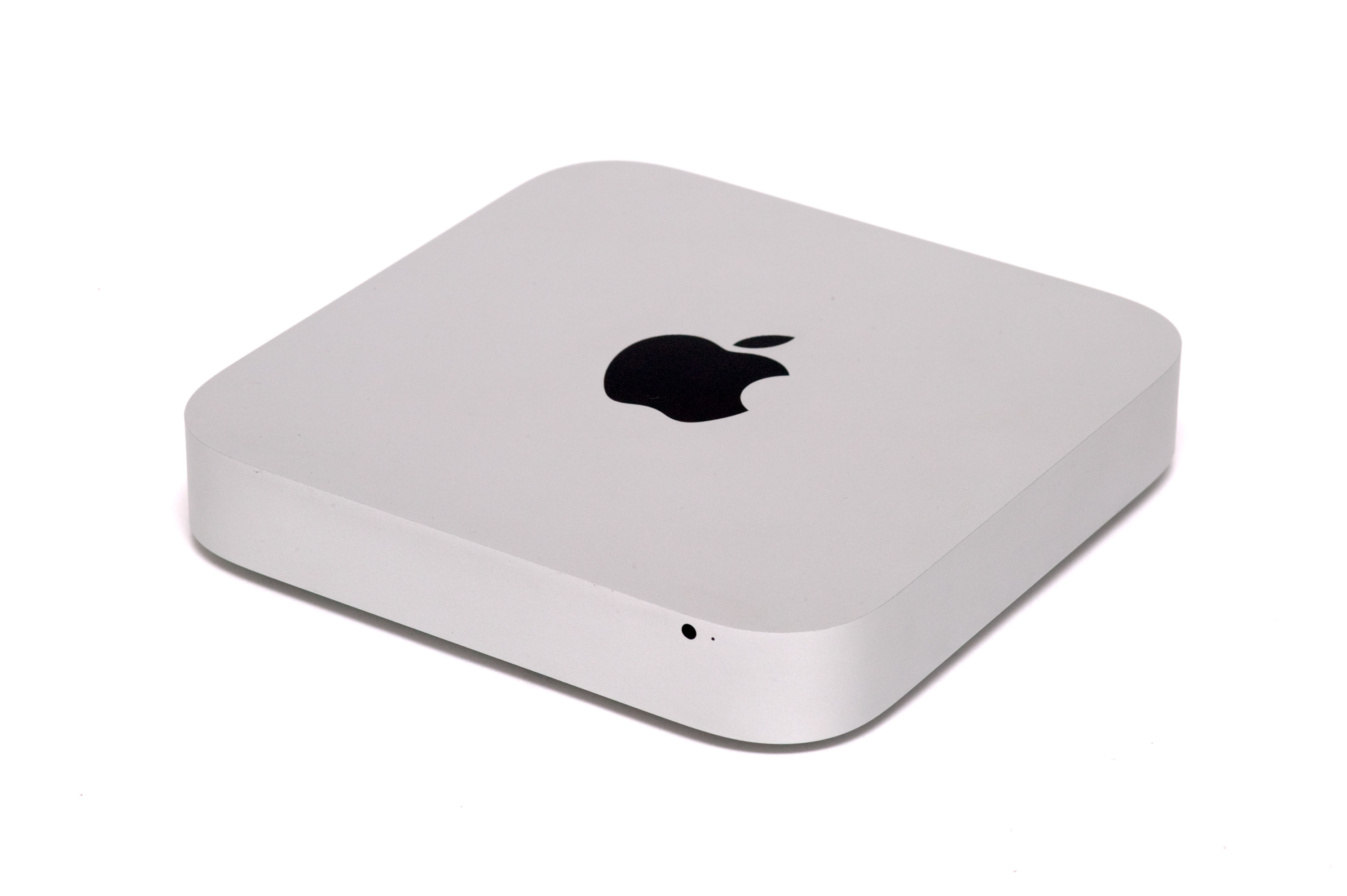 A silver 2012 Mac Mini, the generation used as the computing nodes inside the Spanish Cray-1 replica.