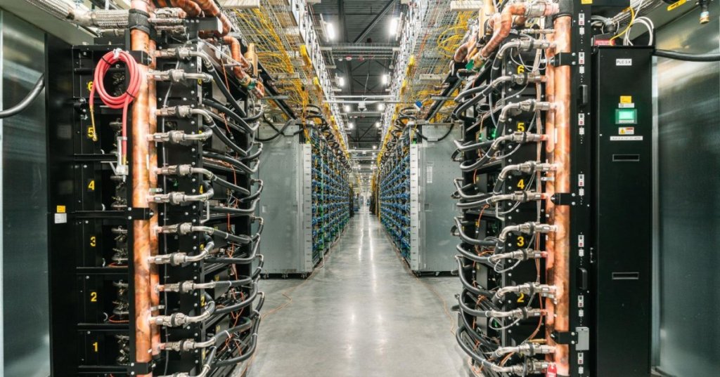 Google Cloud Ironwood TPU data center racks with copper liquid-cooling manifolds, photographed in an equipment aisle