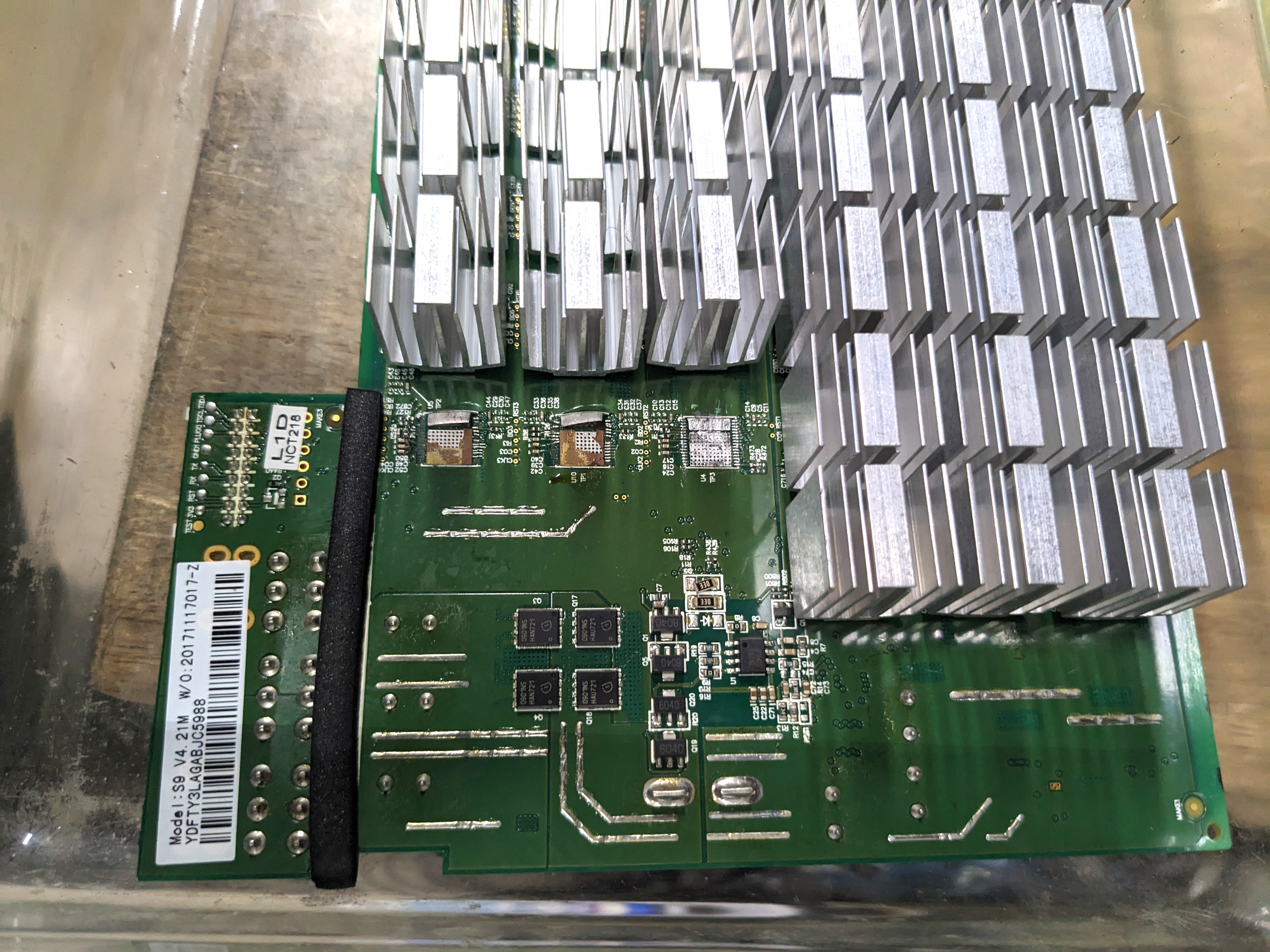Close-up original photograph of Bitmain Antminer BM1387B mining ASIC mounted on a printed circuit board