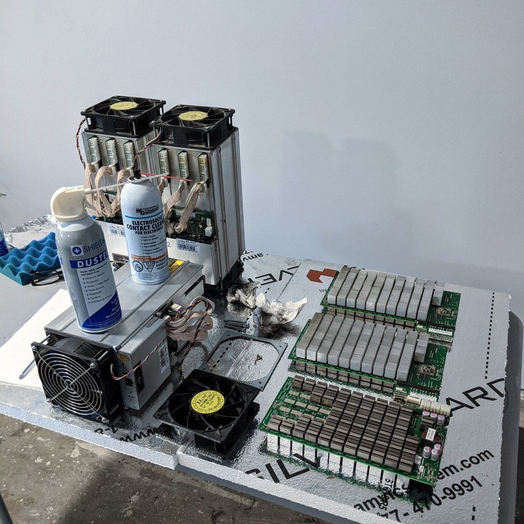 A Bitcoin miner disassembled to board level during annual maintenance and cleaning.