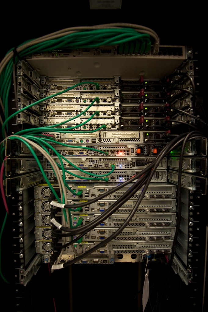 Servers and networking equipment installed in a data center rack, representing the compute systems connected by an AI network fabric.