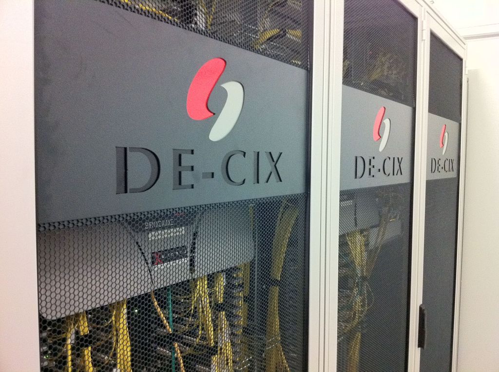 High-density network switch rack representing the scale-out Ethernet fabric used to connect AI infrastructure across a data center.