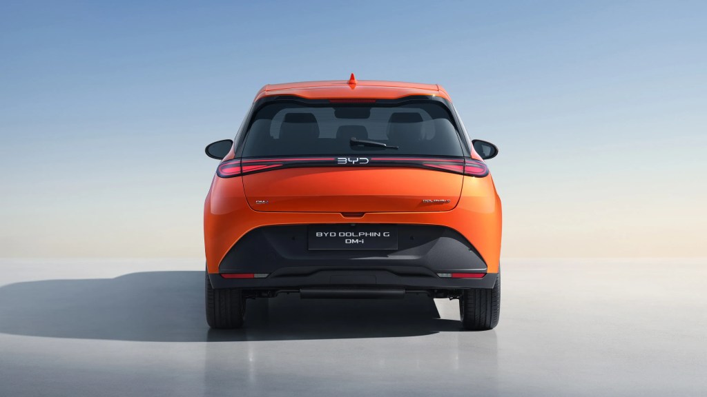 Rear view of the orange BYD Dolphin G DM-i plug-in hybrid compact car