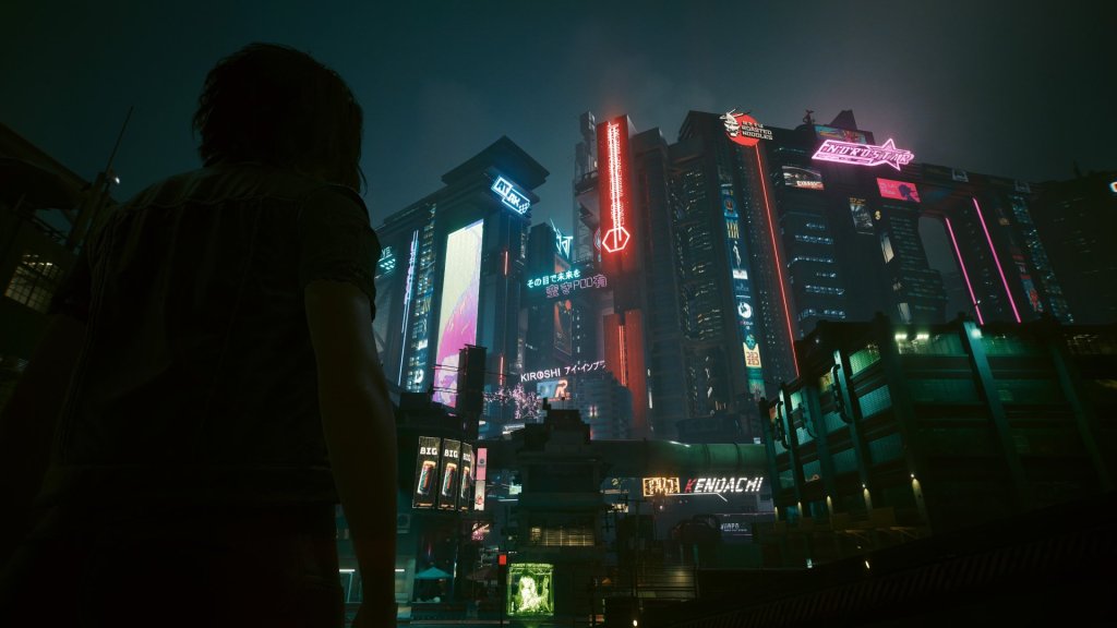A silhouetted Cyberpunk 2077 character looking over the neon skyline of Night City