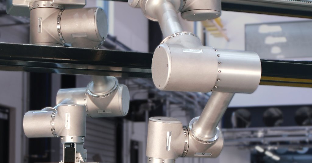 Danu Robotics articulated recycling robot arms working over an industrial waste-sorting conveyor