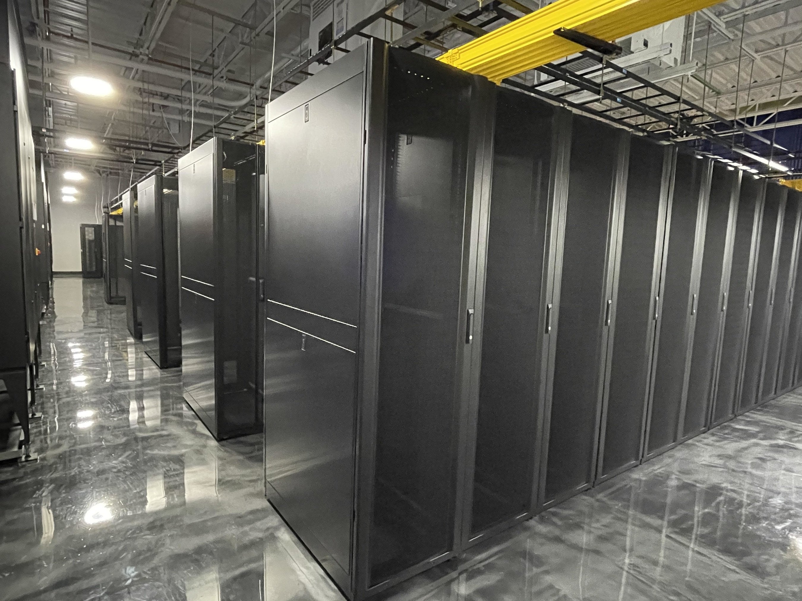 Server cabinets and overhead cable trays inside DRFortress Honolulu