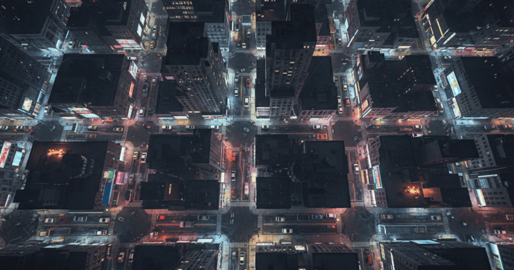 Top-down retro city streets at night with modern path-traced neon lighting and reflections