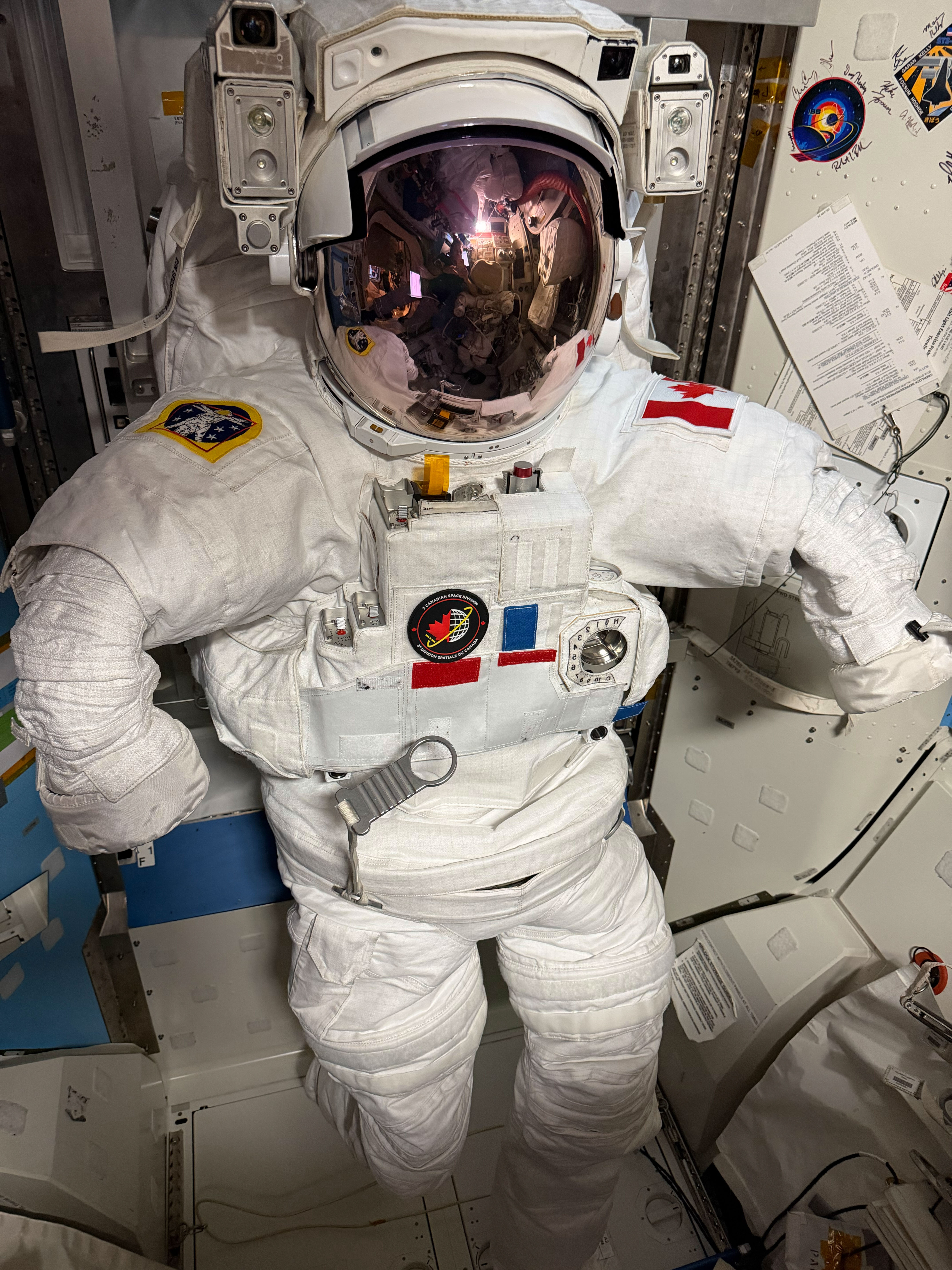 The white spacesuit with a Canadian flag prepared for Joshua Kutryk inside the ISS Quest airlock on October 25, 2026