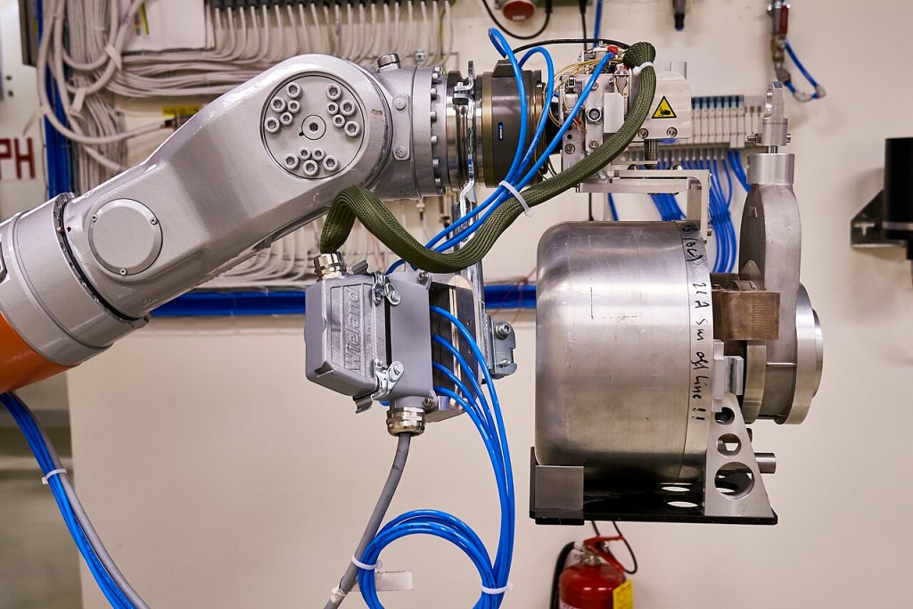 KUKA robot at CERN MEDICIS with external cabling along its arm.