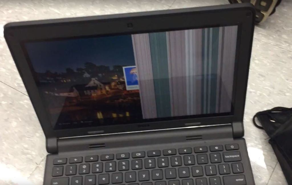 Laptop LCD showing vertical bars and display corruption caused by a faulty connector