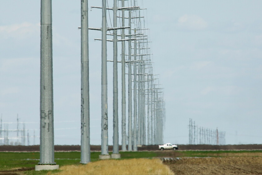 Transmission towers on farmland near the Bison Substation in the Mapleton area of North Dakota