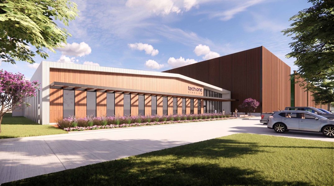 Architectural rendering of a proposed Tech oNE Crossing Project Horizon data center with landscaped entrance and large building