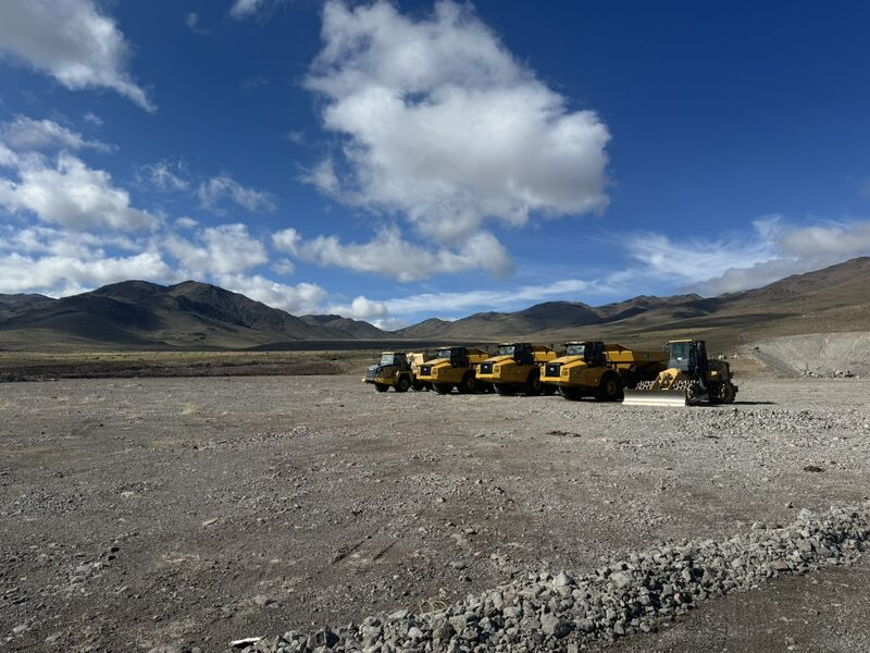 Construction trucks on graded ground at a Tract-associated Nevada data center development site