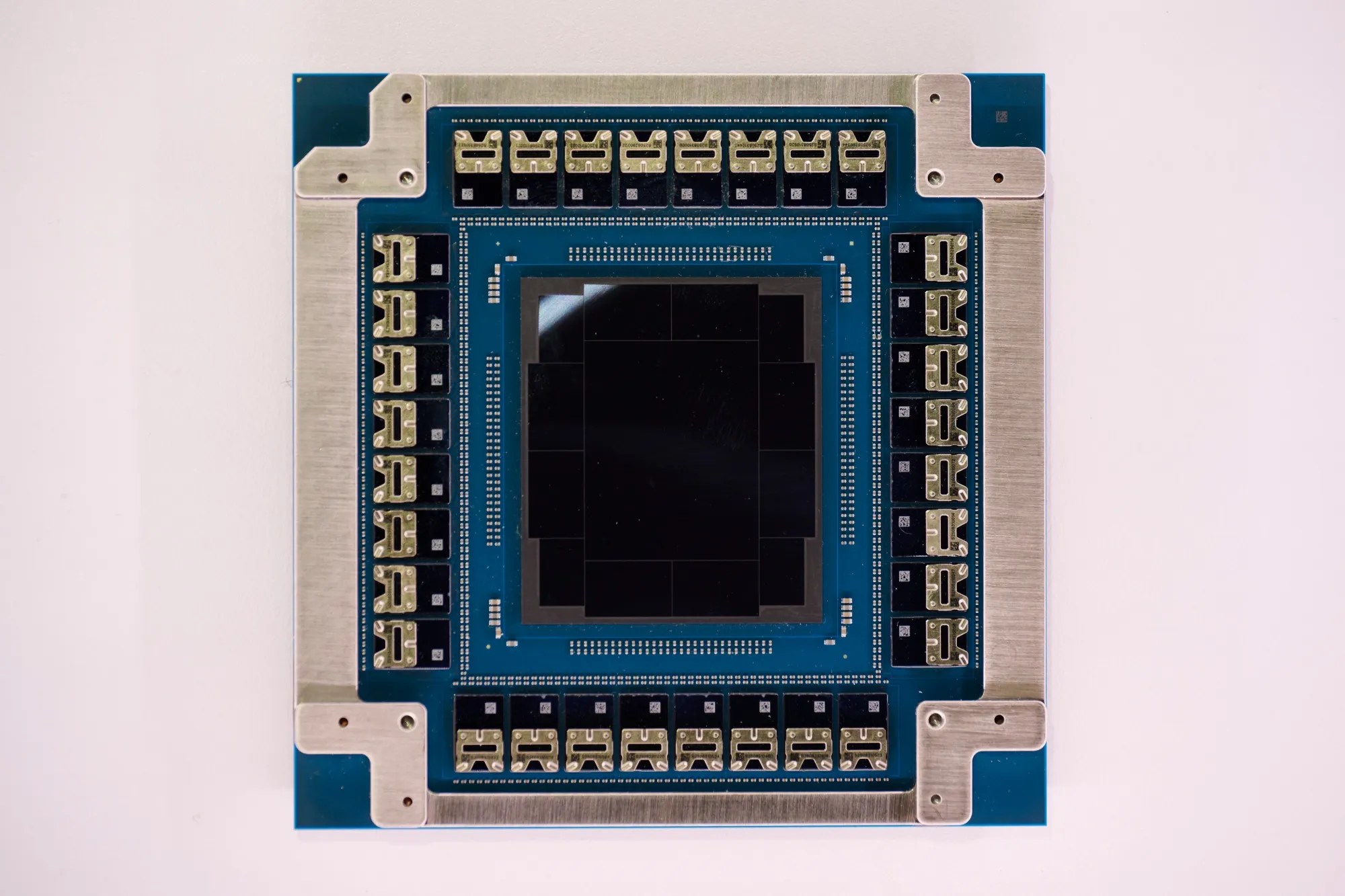 NVIDIA Spectrum-X photonics switch chip with surrounding optical connector modules