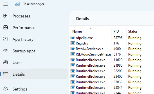 Official Microsoft Windows Task Manager Details view showing running processes and their PID values.