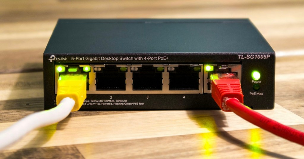Realistic Ethernet network switch with connected cables representing Spanning Tree Protocol and redundant switched links.
