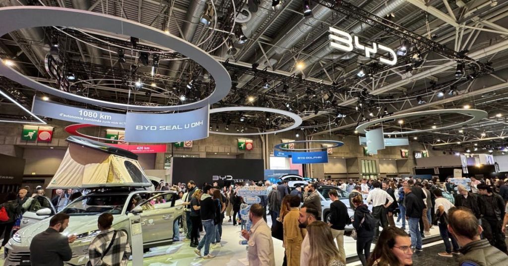 Crowds exploring the BYD stand at the Paris Motor Show