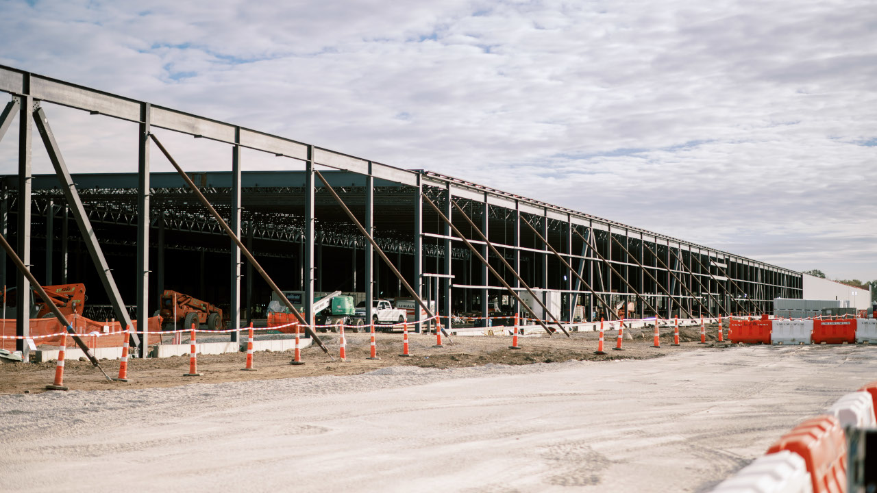 Steel framework and work vehicles at the QTS Cedar Rapids data center construction site