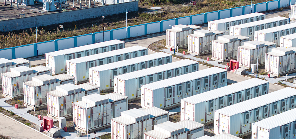 Rows of battery storage units at the SOHO battery project in Brazoria County, Texas