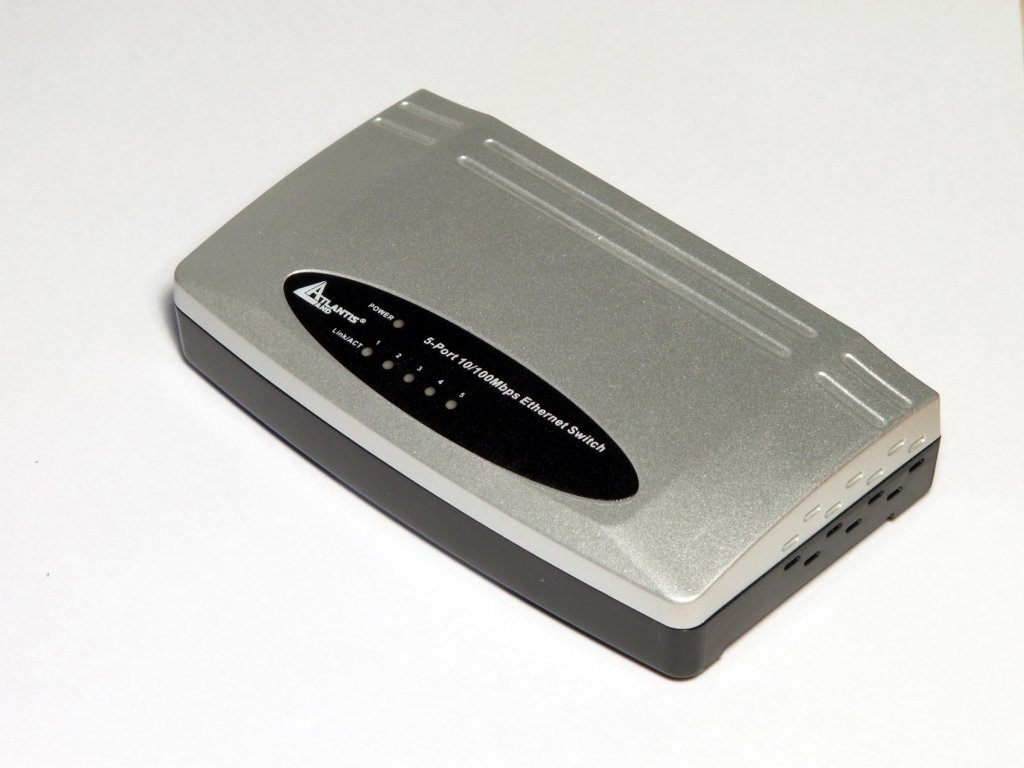 Front view of a simple five-port desktop Ethernet switch representing an unmanaged plug-and-play switch.