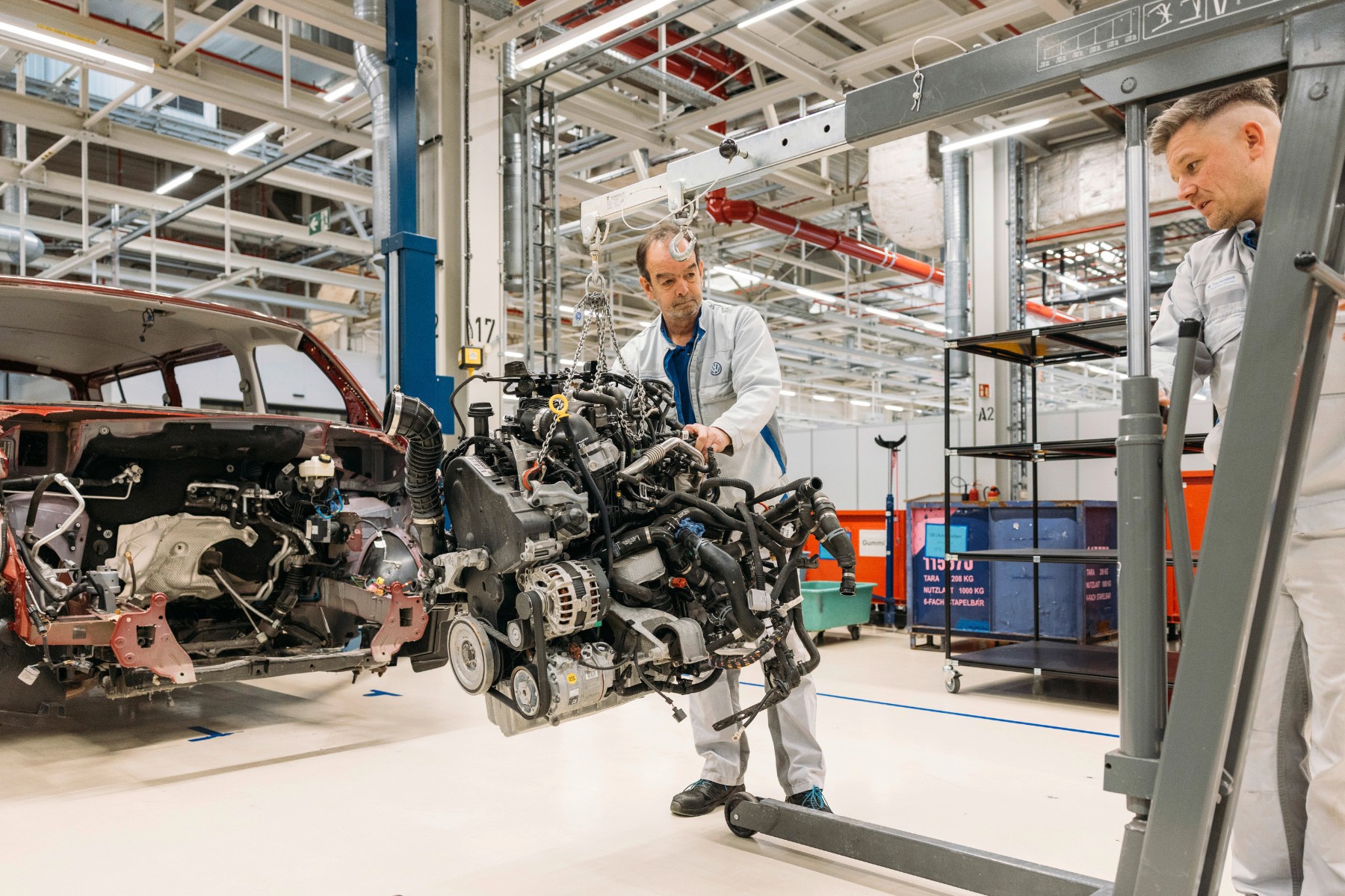 Volkswagen employees removing an engine at the Zwickau dismantling operation in January 2026