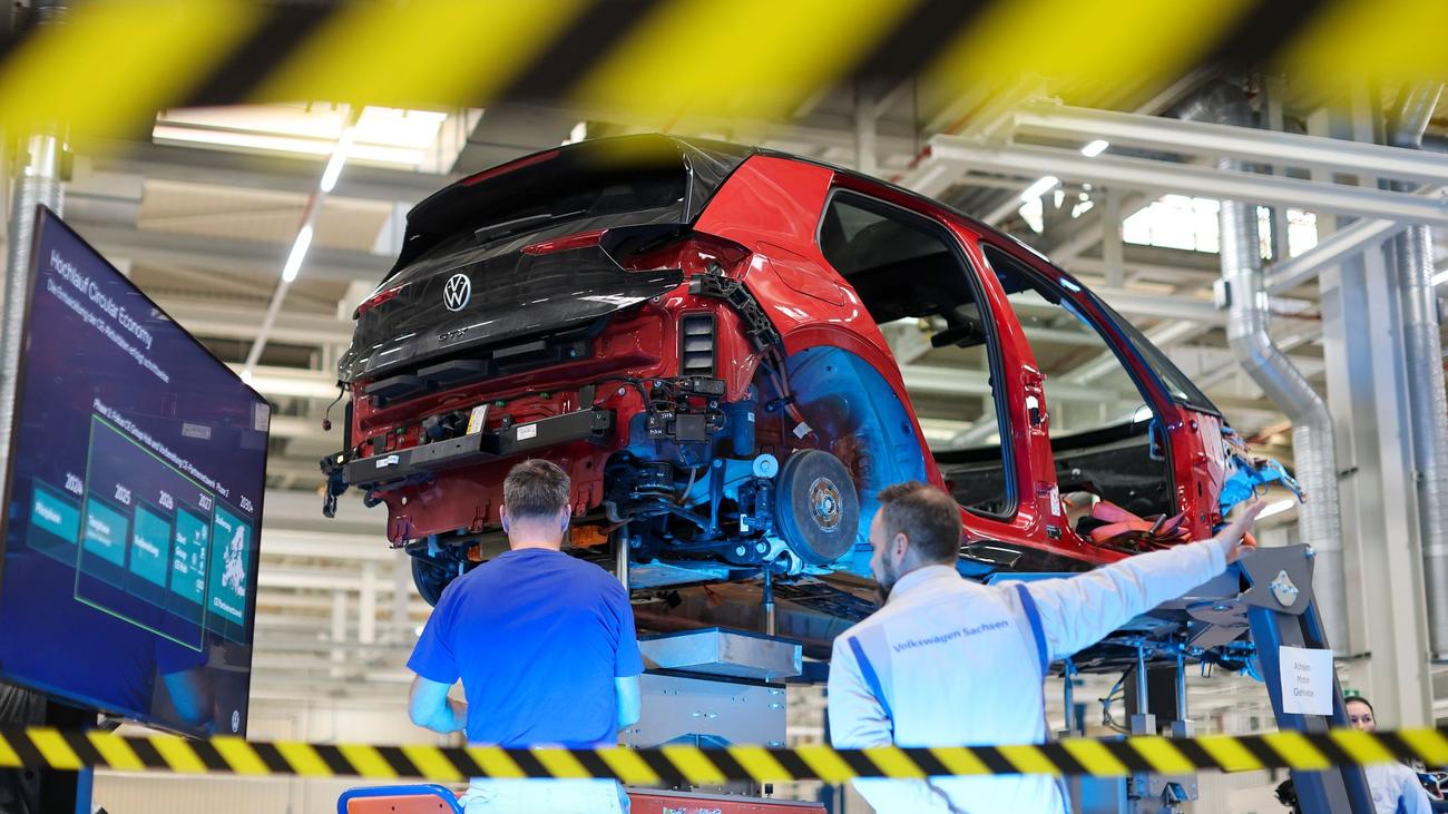 Red Volkswagen ID.3 electric hatchback partly dismantled on a lift at Zwickau in January 2026
