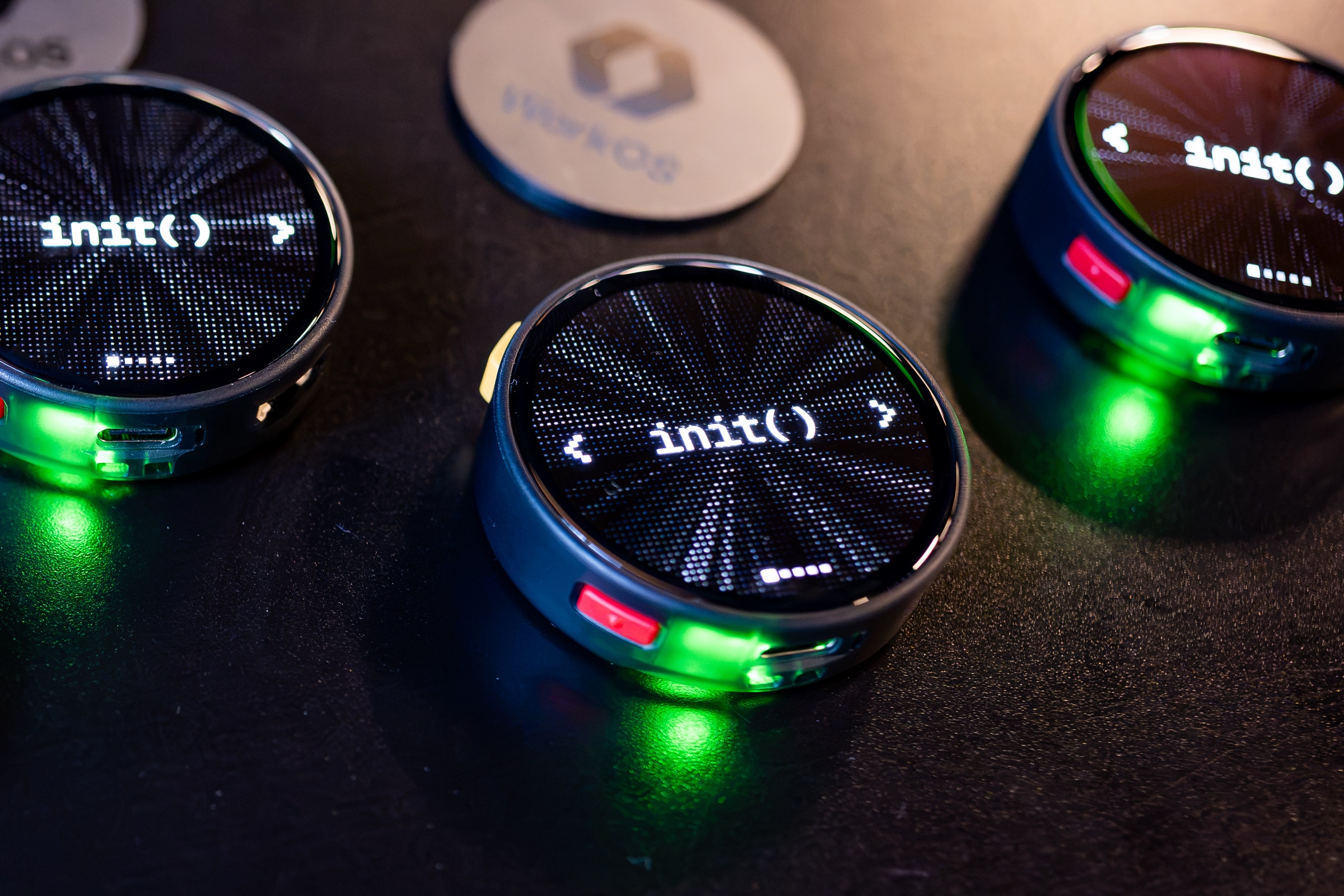 Actual WorkOS init conference badges with round screens